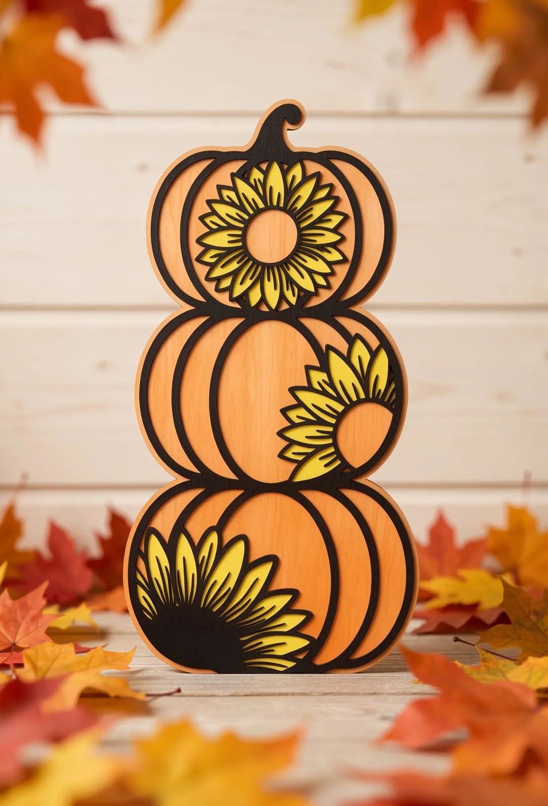 Orange pumpkin stack with three yellow sunflowers layered across it, pumpkin laser cut SVG from svgdiy.com